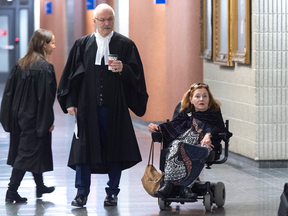 Nicole Gladu, who is incurably ill, and her lawyer Jean-Pierre Menard arrive at the courthouse in Montreal on Monday, January 7, 2019, for the beginning of a trial challenging the provincial and federal laws on medically assisted death.