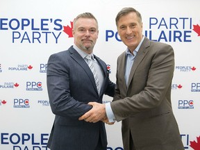 People's Party of Canada leader Maxime Bernier, right, poses with James Seale, a candidate for the upcoming federal byelection in the riding of Outremont during an event in Montreal, Sunday, January 27, 2019. The federal byelection will take place on February 25.