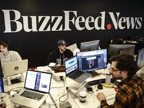 Members of the BuzzFeed News team work at their desks at BuzzFeed headquarters, December 11, 2018 in New York City.
