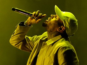 In this file photo taken on May 20, 2016 US singer Chris Brown preforms during the World Music Festival "Mawazine" in Rabat. - US rapper Chris Brown is detained in Paris after a rape claim, security sources told on January 22, 2019.