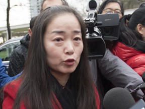 Former Burnaby South candidate Karen Wang is asked to leave the site where she had called a news conference for by Burnaby Public Library Chief Librarian Beth Davies in Burnaby, B.C. Thursday, Jan. 17, 2019.