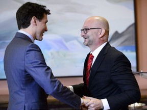 Prime Minister Justin Trudeau greets Justice Minister and Attorney General of Canada David Lametti at a swearing in ceremony at Rideau Hall in Ottawa on Monday, Jan. 14, 2019.