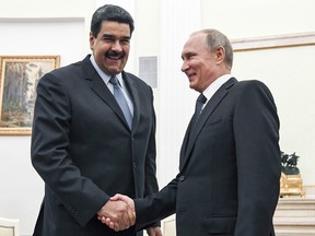 Russian President Vladimir Putin, right, shakes hands with Venezuela's President Nicolas Maduro during their meeting at the Kremlin in Moscow, Russia, on October 4, 2017.