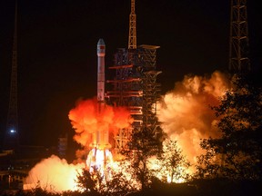 A photo taken early on Dec. 8, 2018, shows a Long March 3B rocket transporting the moon-bound Chang'e-4 lunar rover, lifting off from the Xichang launch centre in China's southwestern Sichuan province.