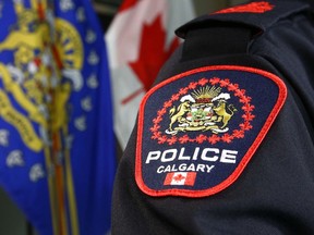 A Calgary Police officer displays a shoulder badge in Calgary on Thursday, January 10, 2019.