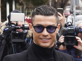 Cristiano Ronaldo and his girlfriend Georgina Rodriguez arrive at the Provincial Court of Madrid in Madrid, Spain, where he accepted a £16million fine and a suspended prison sentence over tax fraud charges.