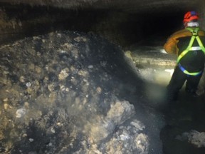In this photo released Tuesday Jan. 8, 2019, by Britain's South West Water company, showing part of a "fatberg", a mass of hardened fat, oil and baby wipes, measuring some 64 meters (210 feet) long, in the town of Sidmouth, England.  The fatberg is blocking a sewer in the southwestern English town, and will take a sewer team around eight weeks to dissect and dispose of the obstruction.