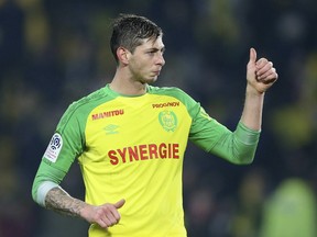 In this his picture taken on Jan. 14, 2018, Argentine soccer player Emiliano Sala of the FC Nantes club gives a thumbs up during a soccer match against PSG in Nantes, France.