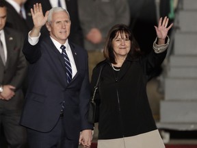 U.S. Vice President Mike Pence and his wife Karen wave as they landed at Tel Aviv airport Sunday, Jan. 21, 2018.