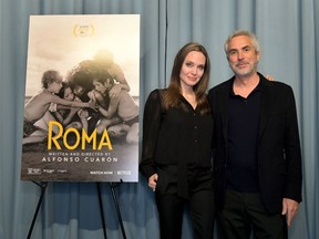 Angelina Jolie and Alfonso Cuarón attend the "ROMA" Tastemakers Screening and Reception at San Vicente Bungalows on January 05, 2019 in West Hollywood, California.