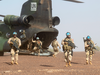 Canadian infantry and medical personnel disembark a Chinook helicopter as they take part in a medical evacuation demonstration on the United Nations base in Gao, Mali, Dec. 22, 2018.