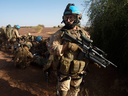 A Canadian soldier provides security as medics assist German troops during a medical evacuation demonstration on the United Nations base in Gao, Mali, on Dec. 22, 2018.