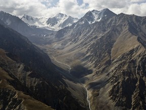 This Aug. 15, 2016 photo, shows an ariel view of the snow-capped Pamir mountains in the Wakhan district of Badakhshan province, far northeastern Afghanistan.