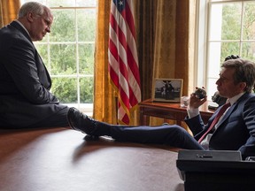 Christian Bale stars as Dick Cheney, left, and Sam Rockwell portrays George W. Bush in a scene from "Vice."
