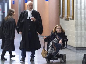 Nicole Gladu, who is incurably ill, and her lawyer Jean-Pierre Menard arrive at the courthouse in Montreal on Monday, January 7, 2019, for the beginning of a trial challenging the provincial and federal laws on medically assisted death on the grounds they are too restrictive.