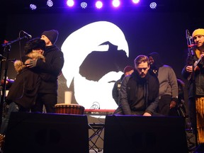 Members of Walk Off the Earth embrace while performing during a Walk Off The Earth Memorial & Tribute Concert for Mike "Beard Guy" Taylor in Burlington, Ont., on Sunday, January 13, 2019. Acoustic performances by members of Barenaked Ladies, Scott Helman, Monster Truckv and more were also scheduled for the event.