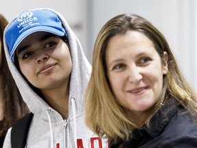 Saudi teenager Rahaf Mohammed Alqunun with Canadian Minister of Foreign Affairs Chrystia Freeland as she arrives at Toronto Pearson International Airport, on Jan. 12, 2019.
