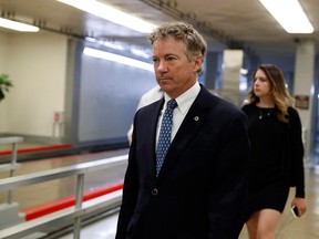 Sen. Rand Paul, R-Ky., walks to the Senate on Capitol Hill in Washington on May 17, 2018. The senator plans to undergo hernia surgery at a private hospital in Canada because of injuries he suffered when a neighbour tackled him while he was doing yard work at his Kentucky home.