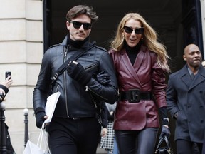 Singer Céline Dion leaves the Givenchy office on Avenue George V in Paris with dancer Pepe Munoz, whom she is not dating.