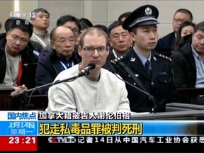 In an image taken from video footage by China's CCTV, Canadian Robert Schellenberg attends his retrial in Dalian, China, where he was sentenced to death on Jan. 14, 2019.