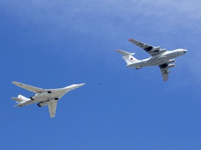 Russian Air Force's IL-78 air-to-air refuelling tanker, right, demonstrates in-flight refuelling of a Tu-160 strategic bomber over Red Square during the Victory Day military parade to celebrate 73 years since the end of WWII and the defeat of Nazi Germany, in Moscow, Russia, Wednesday, May 9, 2018. Military authorities say U.S. Air Force and Canadian fighter jets were scrambled to escort two Russian bombers that were travelling near the North American coastline.