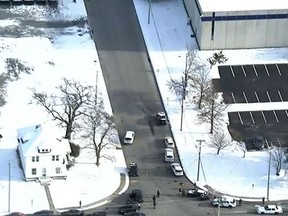 In this image provided by WPVI-TV/6ABC, police respond to a report of an active shooter at a United Parcel Service facility in Logan Township, N.J., Monday, Jan. 14, 2019.