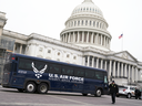 An empty U.S. Air Force bus waits outside the U.S. Capitol for a Congressional delegation, including House Speaker Nancy Pelosi, that was scheduled for an overseas trip Jan. 17, 2019 in Washington.