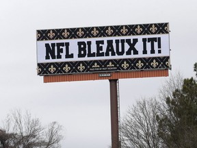 A billboard protesting a controversial call in the Sunday's NFL football game between the New Orleans Saints and Los Angeles Rams is shown along Interstate 75 near Hartsfield Jackson Atlanta International Airport in Atlanta Tuesday, Jan. 22, 2019.