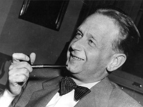 In this May 19, 1953 file photo, Dag Hammarskjold, recently appointed secretary general of the United Nations, smokes his pipe at a press conference held at the Foreign Office in Stockholm.