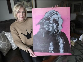 Judy Danford holds a self portrait painted by her daughter Victoria Hillier on Jan. 24, 2019 at her Kingsville home. Hillier committed suicide in December 2018 after years of mental health issues.