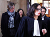 Canadian Emily Spanton, left, arrives with her lawyers at court in Paris, Jan. 14, 2019.