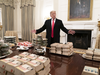 U.S President Donald Trump presents fast food to be served to the Clemson Tigers football team to celebrate their championship, at the White House on Jan. 14, 2019.