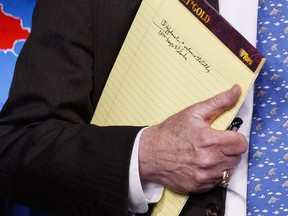 National security adviser John Bolton holds his notes during a press briefing at the White House, Monday, Jan. 28, 2019, in Washington.