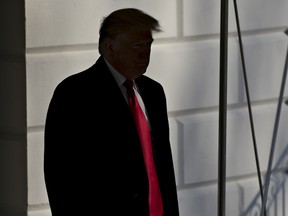 U.S. President Donald Trump walks out of the White House before boarding Marine One in Washington, D.C., U.S., on Sunday, Jan. 6, 2019. Trump is willing to rule out concrete for a wall on the southern U.S. border to reach a deal with Congressional Democrats and end a partial government shutdown, acting White House chief of staff Mick Mulvaney said. Photographer: Andrew Harrer/Bloomberg ORG XMIT: 775278071