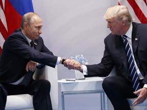 President Donald Trump shakes hands with Russian President Vladimir Putin at the G20 Summit, Friday, July 7, 2017, in Hamburg.