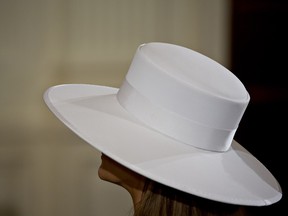 U.S. First Lady Melania Trump wears a hat while attending a news conference with U.S. President Donald Trump and Emmanuel Macron, France's president, not pictured, in the East Room of the White House during a state visit in Washington, D.C., U.S., on Tuesday, April 24, 2018.