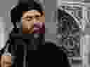 This image made from video posted on a militant website July 5, 2014, shows the leader of ISIL, Abu Bakr al-Baghdadi, delivering a sermon at a mosque in Iraq during his first public appearance. 