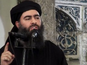 This image made from video posted on a militant website July 5, 2014, shows the leader of ISIL, Abu Bakr al-Baghdadi, delivering a sermon at a mosque in Iraq during his first public appearance.
