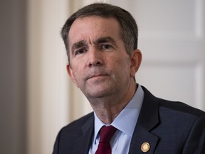 Virginia Governor Ralph Northam speaks with reporters at a press conference at the Governor's mansion in Richmond, Virginia.