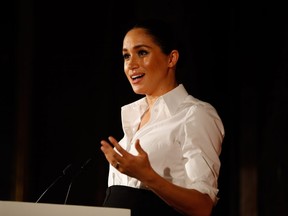 Meghan, Duchess of Sussex presents the Celebrating Excellence Award to Nathan Forster, a former soldier of the Army's Parachute Regiment, at the Endeavour Fund awards at Drapers' Hall on February 7, 2019 in London, England.