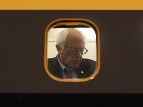 Then-Democratic presidential candidate Sen. Bernie Sanders is seen through the  window of his plane on the tarmac at Signature Flight Support as he continues to campaign on February 18, 2016 in Las Vegas, Nevada.