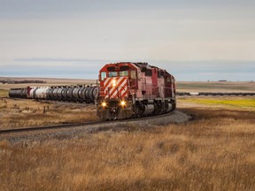 A train charges a hill near Milk River, Alberta on its way to the United States.
