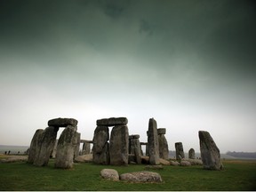 Visitors and tourists walk around the ancient monument at Stonehenge on March 2, 2012 in Wiltshire, England.