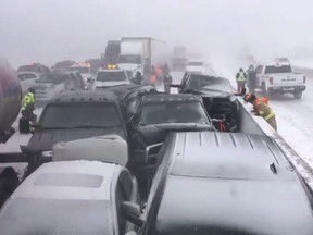 Vehicles are piled up after a crash on Highway 400 south of Barrie, Ont. on Monday, Feb.25, 2019 in a photo from the Twitter user @OPP_HSD. Authorities say a major highway in southern Ontario has been closed in both directions to deal with a collision involving dozens of vehicles.