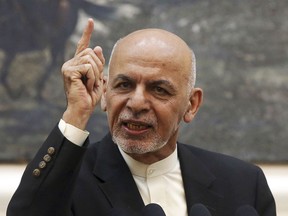 FILE - In this July 15, 2018, file photo, Afghan President Ashraf Ghani speaks during a press conference at the presidential palace in Kabul, Afghanistan. The Afghan government has fired its election commission, Tuesday, Feb. 12, 2019. The move by Ghani's administration comes more than three months after chaotic parliamentary elections -- the results of which have still not been announced -- and ahead of July's controversial presidential vote.