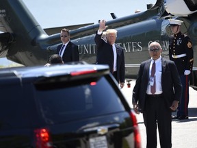 US President Donald Trump disembarks from Marine One upon arrival at Fairmont Le Manoir Richelieu Landing Zone in Charlevoix, Quebec, Canada, June 8, 2018, as Trump travels to attend the G7 Summit.