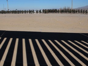 U.S. Border Patrol, Immigration and Customs Enforcement and Customs and Border Protection agents take part in a safety drill in Sunland Park, New Mexico, United States, across from Ciudad Juarez, Chihuahua state, Mexico, on January 31, 2019.