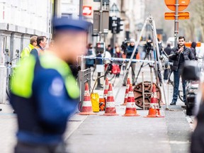 Police cordon off the area outside the French BNP Paribas Fortis bank branch, following a robbery in the centre of Antwerp on February 4, 2019.