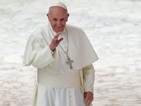 Pope Francis waves to worshipers during an audience with employees of Rome's Regina Coeli prison, on February 7, 2019 at Paul-VI hall in the Vatican.