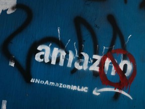 Anti Amazon graffiti is displayed in the Long Island City neighborhood on February 09, 2019 in New York City. According to recent reports, Amazon is reconsidering its plan to locate one of its new headquarters in Long Island City due to the opposition the project has received locally.